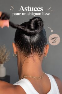Femme avec un chignon sleek parfait, coiffure lisse et élégante.